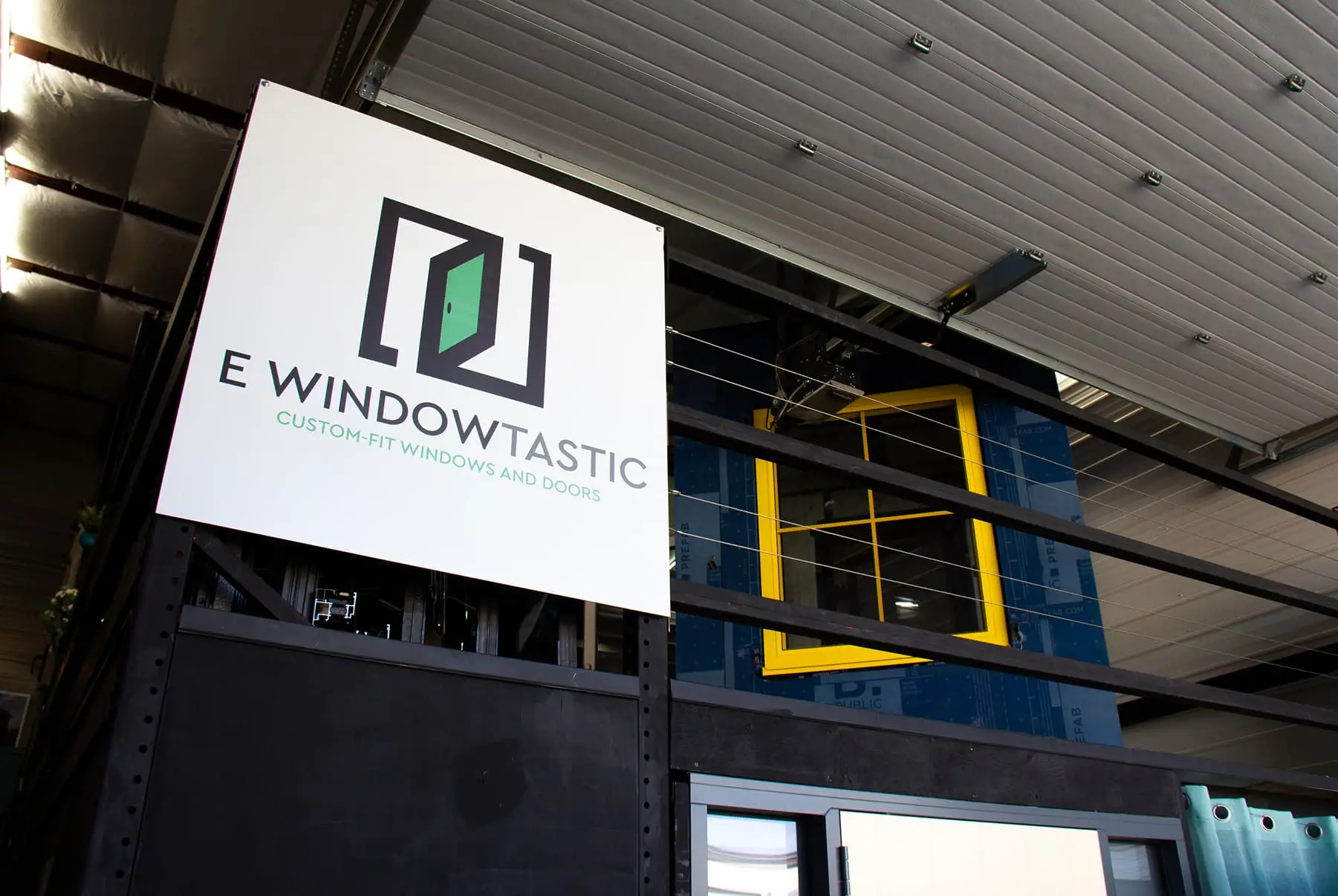 E Windowtastic showroom in Littleton, Colorado, with branded sign and window display.